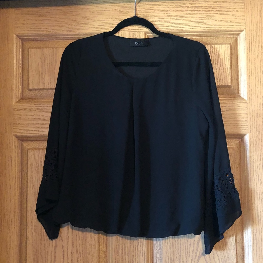 Black blouse with lace detail at the sleeve
